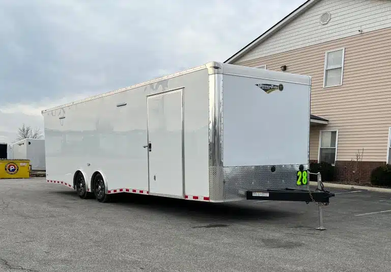 Enclosed Car Hauler 2026 28ft. Extreme w/6K Torsion Spread Axles, Finished Interior w/Cabinets & Alum. Wheels 0592 - front view